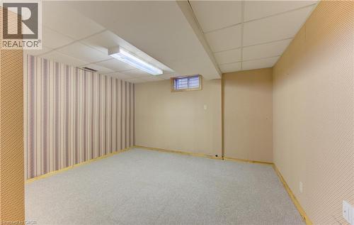 Finished below grade area featuring a paneled ceiling, carpet, and wallpapered walls - 190 Silvercrest Drive, Waterloo, ON - Indoor Photo Showing Basement