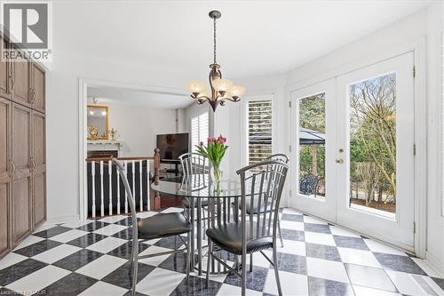 Dining area with french doors, light flooring, and hanging lights - 54 Woodcrest Court, Kitchener, ON - Indoor Photo Showing Dining Room