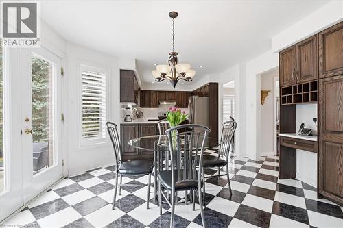 Dining room featuring suspended lighting, light floors, and plenty of natural light - 54 Woodcrest Court, Kitchener, ON - Indoor Photo Showing Dining Room