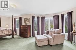 Carpeted bedroom with baseboards - 