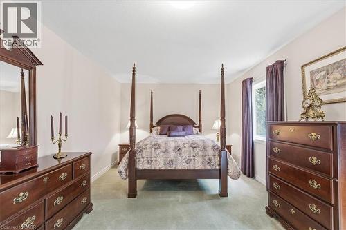 Bedroom featuring light carpet and baseboards - 54 Woodcrest Court, Kitchener, ON - Indoor Photo Showing Bedroom