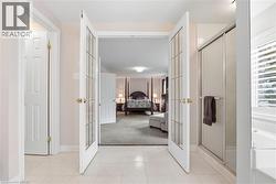 Full bathroom with a shower stall, french doors, a bath, and ensuite bathroom - 