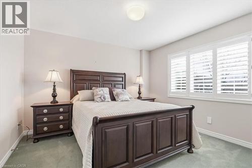 Bedroom with baseboards and light carpet - 54 Woodcrest Court, Kitchener, ON - Indoor Photo Showing Bedroom