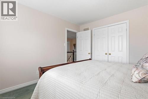 Carpeted bedroom with baseboards and a closet - 54 Woodcrest Court, Kitchener, ON - Indoor Photo Showing Bedroom