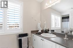 Bathroom with vanity and a shower with shower curtain - 