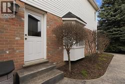 Entrance to property with brick siding - 