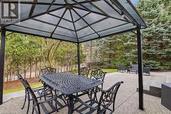 View of patio / terrace with outdoor dining area and a gazebo - 