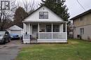 1.5 storey home with a porch, a front yard, and a garage - 391 Lawrence Avenue, Kitchener, ON  - Outdoor With Exterior 
