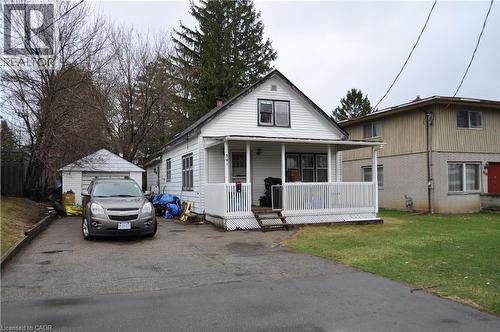 1.5 storey style house featuring covered porch, aluminium siding, and driveway - 391 Lawrence Avenue, Kitchener, ON - Outdoor