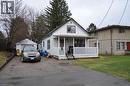 1.5 storey style house featuring covered porch, aluminium siding, and driveway - 391 Lawrence Avenue, Kitchener, ON  - Outdoor 