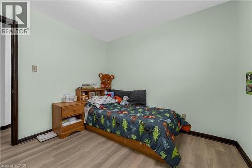 Bedroom featuring wood finished floors and a textured ceiling - 51 Independence Drive, Hamilton, ON - Indoor Photo Showing Bedroom