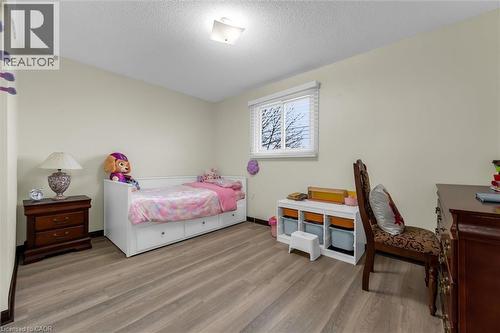 Bedroom with light wood-style flooring and a textured ceiling - 51 Independence Drive, Hamilton, ON - Indoor Photo Showing Bedroom