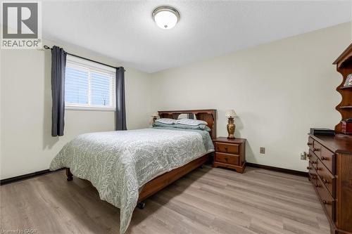 Bedroom featuring light wood-style flooring and a textured ceiling - 51 Independence Drive, Hamilton, ON - Indoor Photo Showing Bedroom