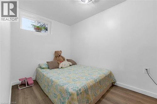 Bedroom with wood finished floors and a textured ceiling - 51 Independence Drive, Hamilton, ON - Indoor Photo Showing Bedroom