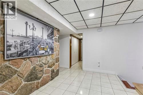 Bar area featuring a paneled ceiling, light tile patterned flooring, and recessed lighting - 3 Chicopee Terrace, Kitchener, ON - Indoor Photo Showing Other Room