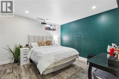 Bedroom with wood finished floors and recessed lighting - 3 Chicopee Terrace, Kitchener, ON - Indoor Photo Showing Bedroom