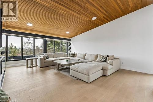 Living room with a vaulted wooden ceiling, light wood-style floors, and recessed lighting - 3 Chicopee Terrace, Kitchener, ON - Indoor Photo Showing Living Room