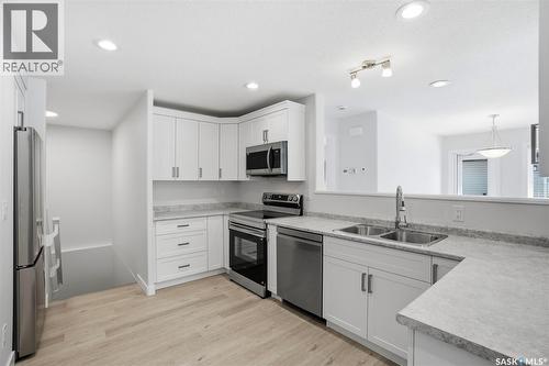27 547 East Hampton Boulevard, Saskatoon, SK - Indoor Photo Showing Kitchen With Double Sink With Upgraded Kitchen