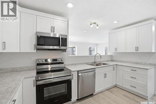 27 547 East Hampton Boulevard, Saskatoon, SK - Indoor Photo Showing Kitchen With Double Sink