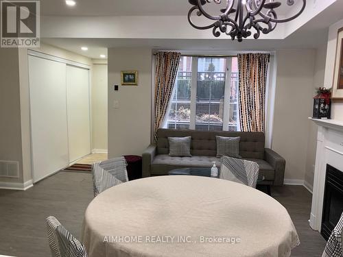 274 - 3 Everson Drive, Toronto, ON - Indoor Photo Showing Dining Room With Fireplace