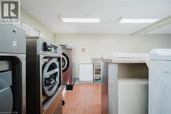 Laundry area with washer and clothes dryer - 