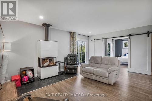3515 Front Road E, Champlain, ON - Indoor Photo Showing Living Room With Fireplace