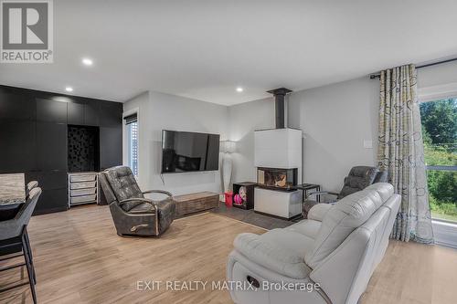 3515 Front Road E, Champlain, ON - Indoor Photo Showing Living Room With Fireplace