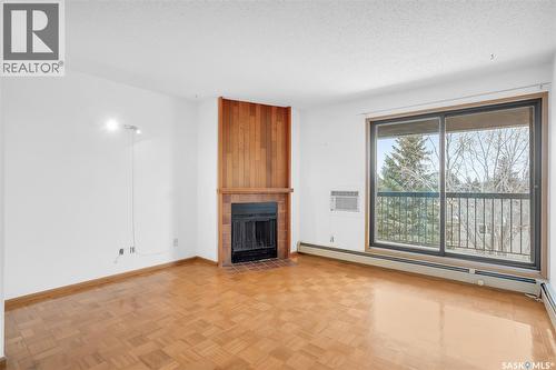 304 385 Kingsmere Boulevard, Saskatoon, SK - Indoor Photo Showing Living Room With Fireplace