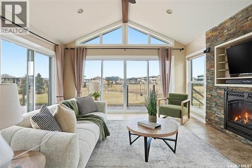 4128 Green Willow Terrace E, Regina, SK - Indoor Photo Showing Living Room With Fireplace