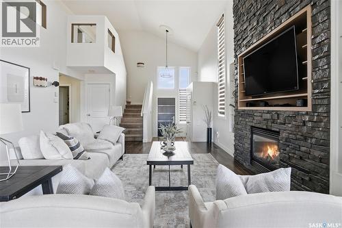 4128 Green Willow Terrace E, Regina, SK - Indoor Photo Showing Living Room With Fireplace