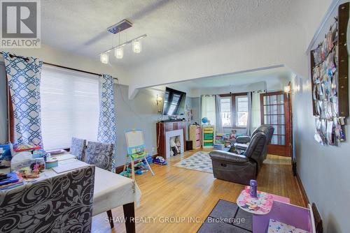 34 Barons Avenue S, Hamilton, ON - Indoor Photo Showing Other Room With Fireplace