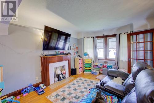 34 Barons Avenue S, Hamilton, ON - Indoor Photo Showing Other Room With Fireplace