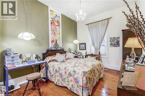 Bedroom with wood-type flooring and suspended lighting - 315 Aberdeen Avenue, Hamilton, ON - Indoor Photo Showing Bedroom