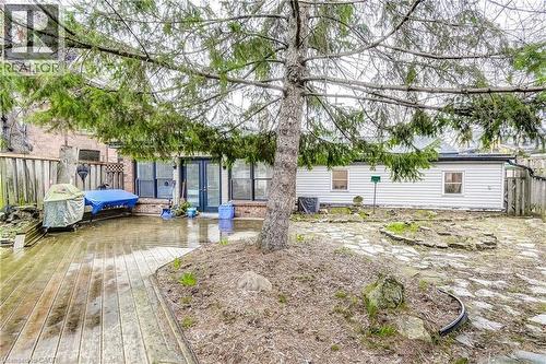 Rear view of house featuring a wooden deck and a patio area - 315 Aberdeen Avenue, Hamilton, ON - Outdoor