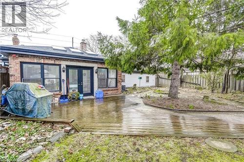 Rear view of property featuring a chimney, french doors, a deck, and brick siding - 315 Aberdeen Avenue, Hamilton, ON - Outdoor With Deck Patio Veranda