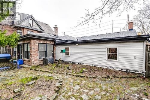 Rear view of property featuring a chimney and brick siding - 315 Aberdeen Avenue, Hamilton, ON - Outdoor