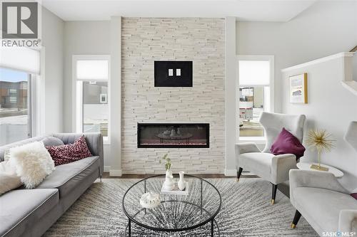 242 Kostiuk Crescent, Saskatoon, SK - Indoor Photo Showing Living Room With Fireplace