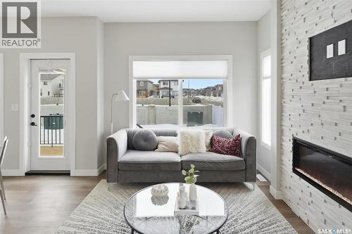 242 Kostiuk Crescent, Saskatoon, SK - Indoor Photo Showing Living Room With Fireplace