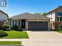 Brick facade residence featuring a two-car garage, a concrete driveway, and a shingle roof - 51 Redtail Crescent, Hamilton, ON  - Outdoor With Facade 