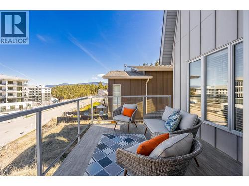 Patio off of the main living area provides a great location to watch the sunset or enjoy a bbq with friends - 1860 Blue Bunch Court, Kelowna, BC - Outdoor With Exterior
