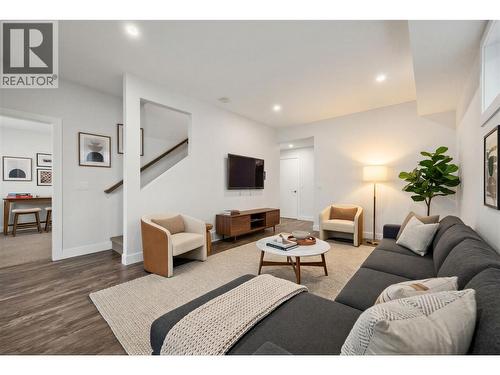 Flex room in the basement could be used for an extra living room, gym, or office! (virtually staged) - 1860 Blue Bunch Court, Kelowna, BC - Indoor Photo Showing Living Room