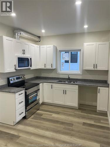 647 Janette Unit# B, Windsor, ON - Indoor Photo Showing Kitchen With Double Sink