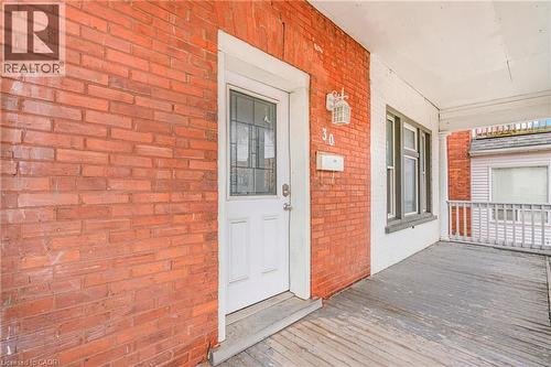 Entrance to property with brick siding and a porch - 30 Regina Street N, Waterloo, ON 