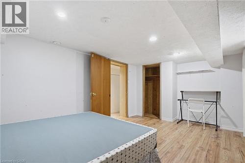 Bedroom featuring light wood-style floors and a closet - 30 Regina Street N, Waterloo, ON 