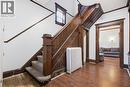 Staircase with wood finished floors and radiator heating unit - 30 Regina Street N, Waterloo, ON 
