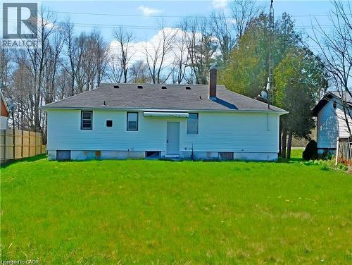 Rear view of property with a chimney and a shingled roof - 2474 Highway 24, Simcoe, ON 