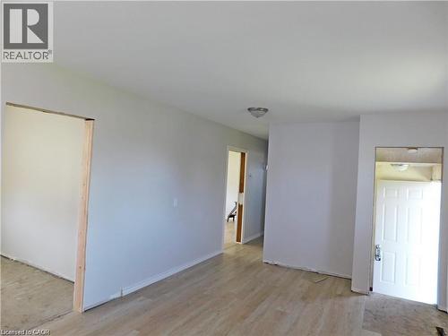 Spare room with light wood-style flooring and baseboards - 2474 Highway 24, Simcoe, ON 