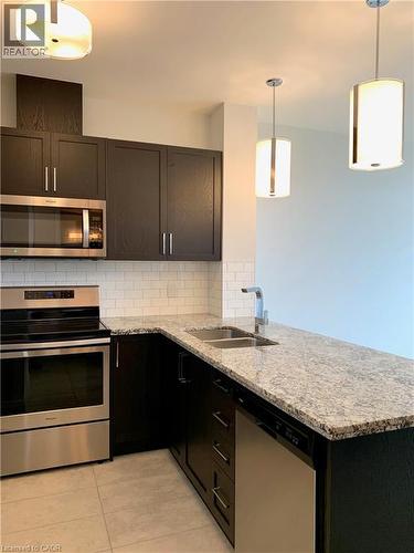 101 Locke Street Unit# 511, Hamilton, ON - Indoor Photo Showing Kitchen With Double Sink