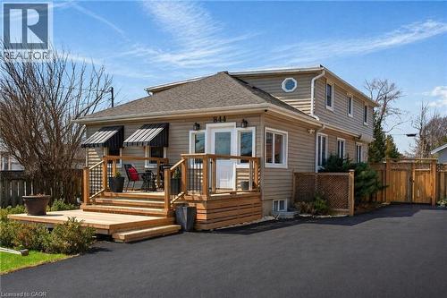 Two-story residence featuring light-colored siding and a dark shingled roof - 844 Upper Wellington Street, Hamilton, ON - Outdoor