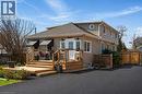Two-story residence featuring light-colored siding and a dark shingled roof - 844 Upper Wellington Street, Hamilton, ON  - Outdoor 